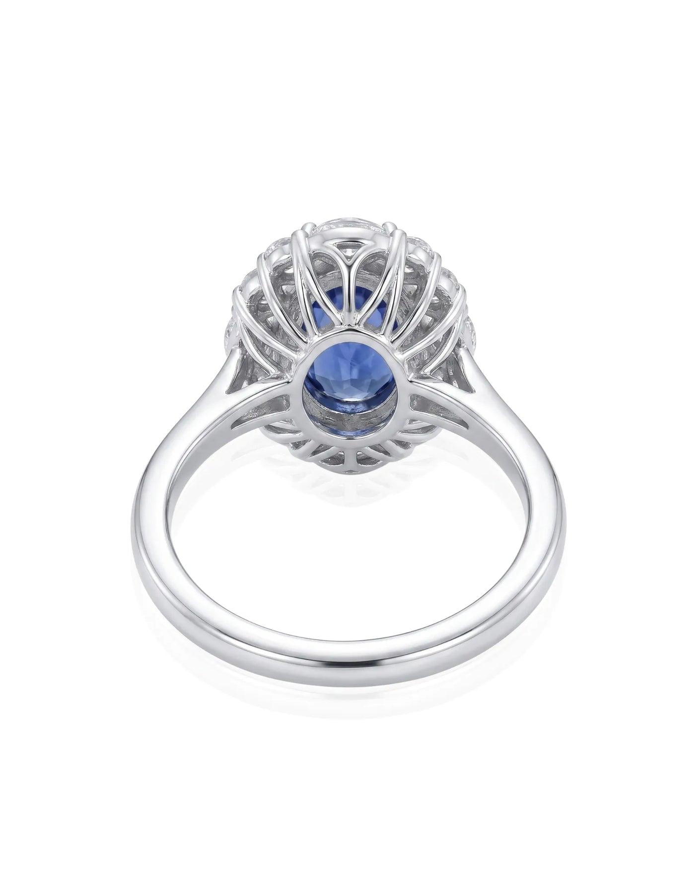 Classic sapphire halo ring with refined diamond frame in platinum | SARATTI