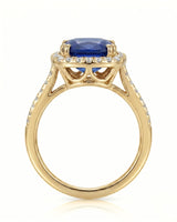 Classic sapphire ring with round diamond halo design in warm 18K yellow gold | SARATTI