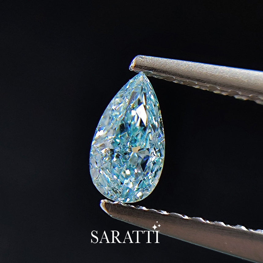 Close-up of 0.385 carat Natural Fancy Blue diamond pear cut | SARATTI  