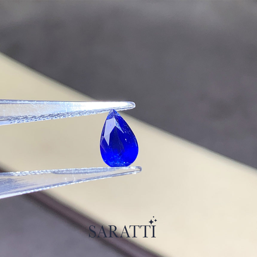 Close-up of 1.20 carat Natural Royal Blue sapphire pear cut | SARATTI 