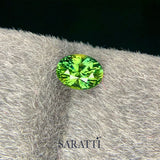 Close-up of 1.26 carat Natural sapphire bluish green oval | SARATTI