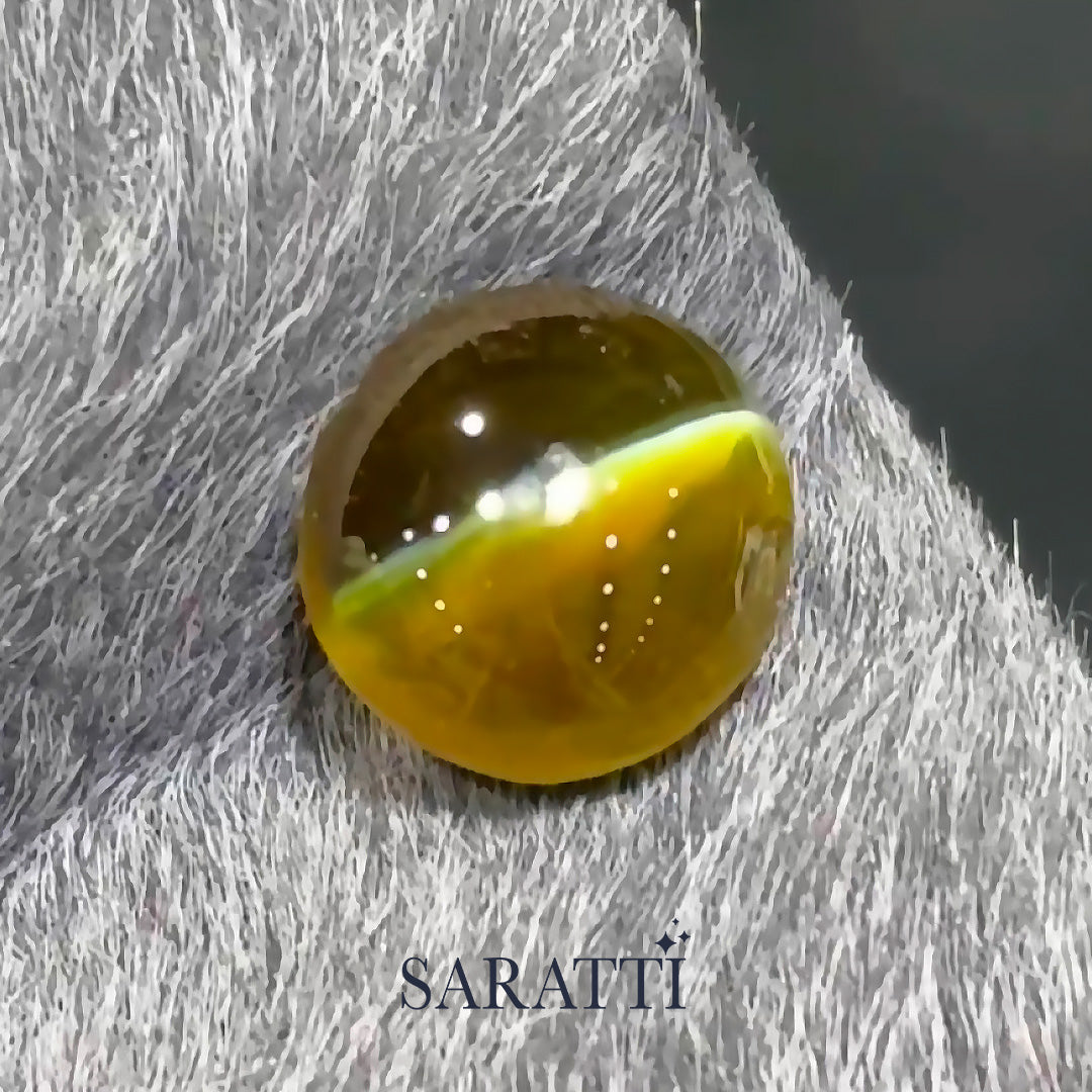 Close-up of 1.53 carat Natural chrysoberyl cabochon displaying eye effect | SARATTI