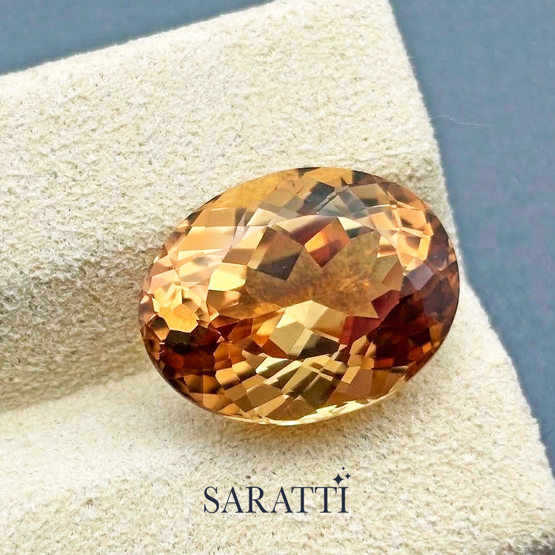 Close-up of 13.65 carat Natural Imperial Topaz oval cut | SARATTI