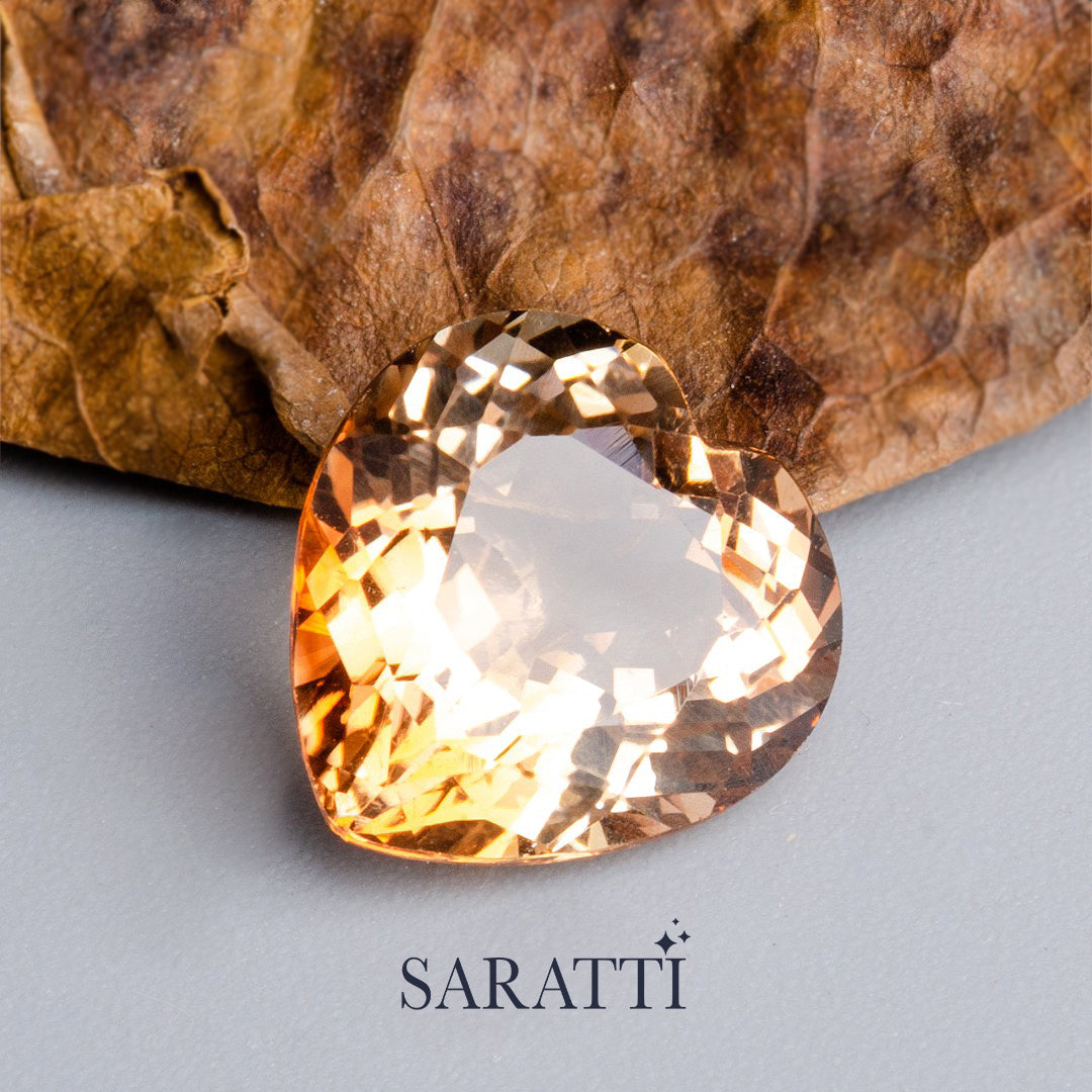 Close-up of 7.48 carat Natural Imperial Topaz heart cut gemstone | SARATTI