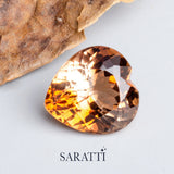 Close-up of 8.00 carat Natural Imperial Topaz heart cut gemstone | SARATTI