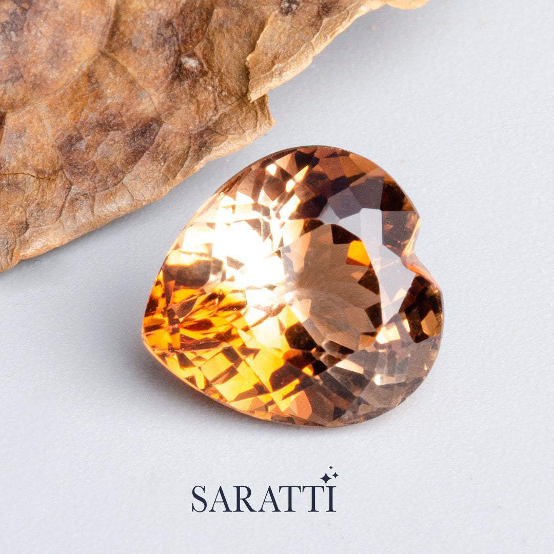 Close-up of 8.00 carat Natural Imperial Topaz heart cut gemstone | SARATTI