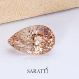 Close-up of 8.62 carat Natural Imperial Topaz pear cut gemstone | SARATTI