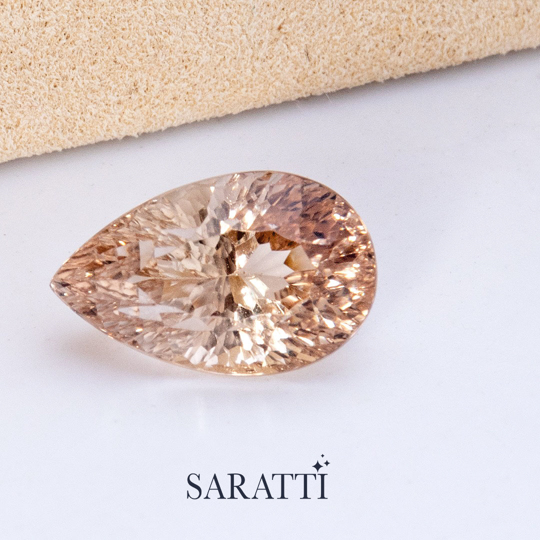 Close-up of 8.62 carat Natural Imperial Topaz pear cut gemstone | SARATTI
