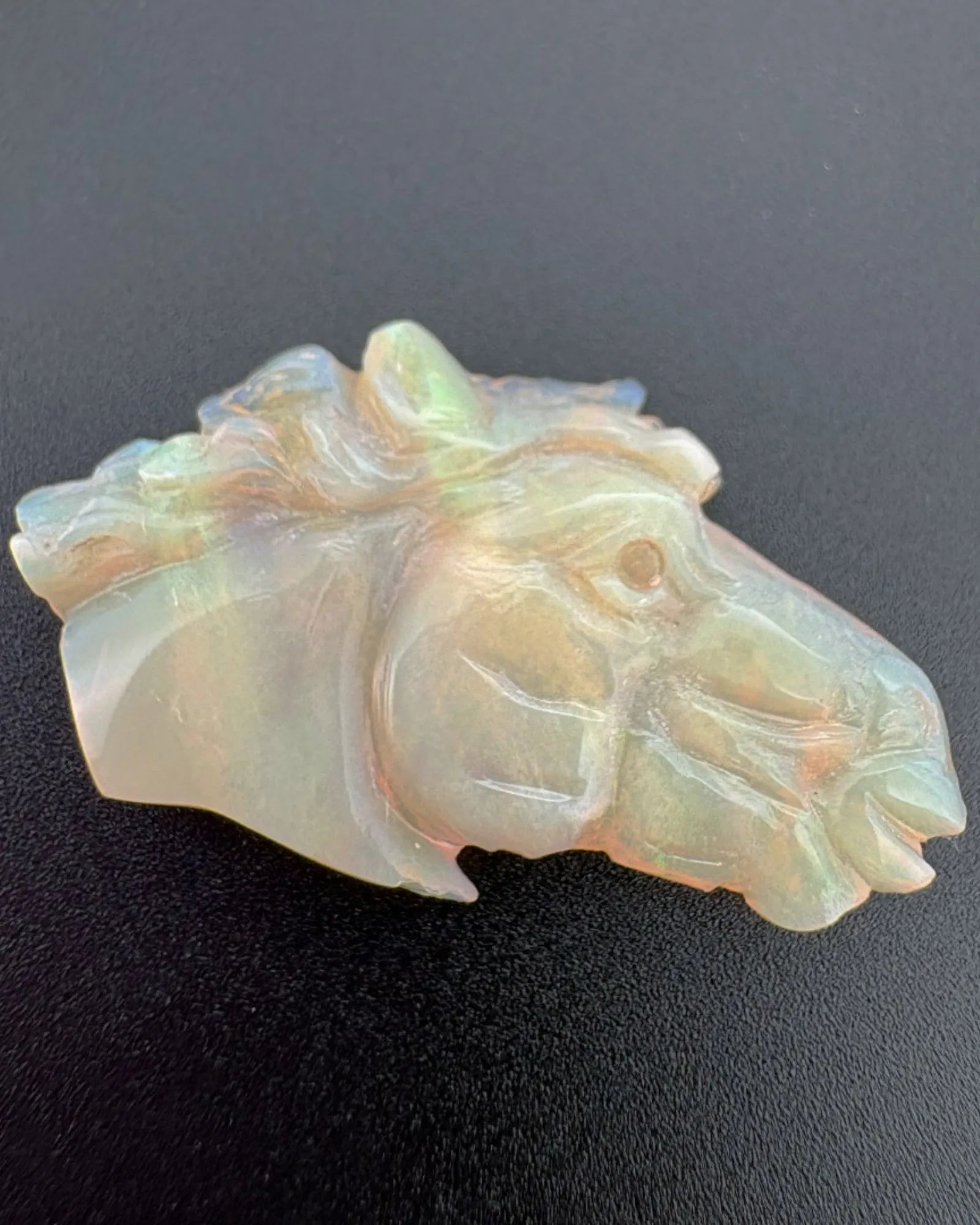 Close-up of Ethiopian White Opal horse mane and eye carving | SARATTI