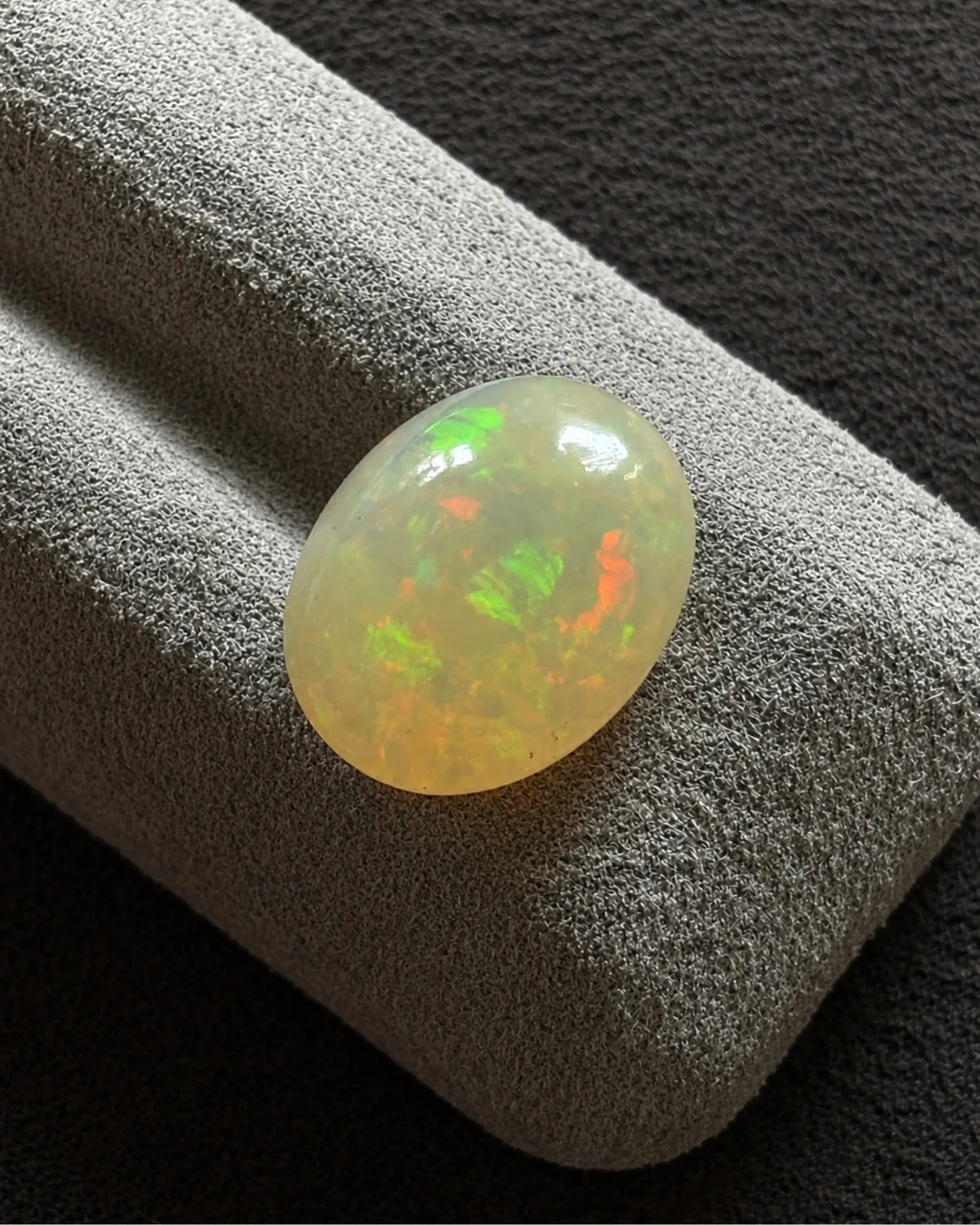 Close-up of Ethiopian White Opal multicoloured surface detail | SARATTI