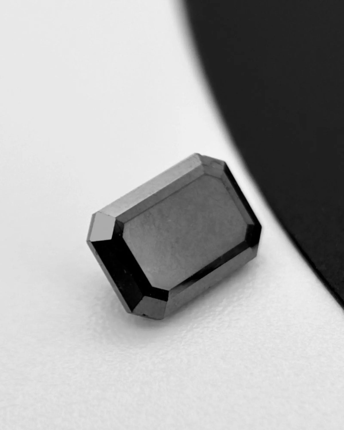 Close-up of Natural Black Diamond step-cut reflections | SARATTI