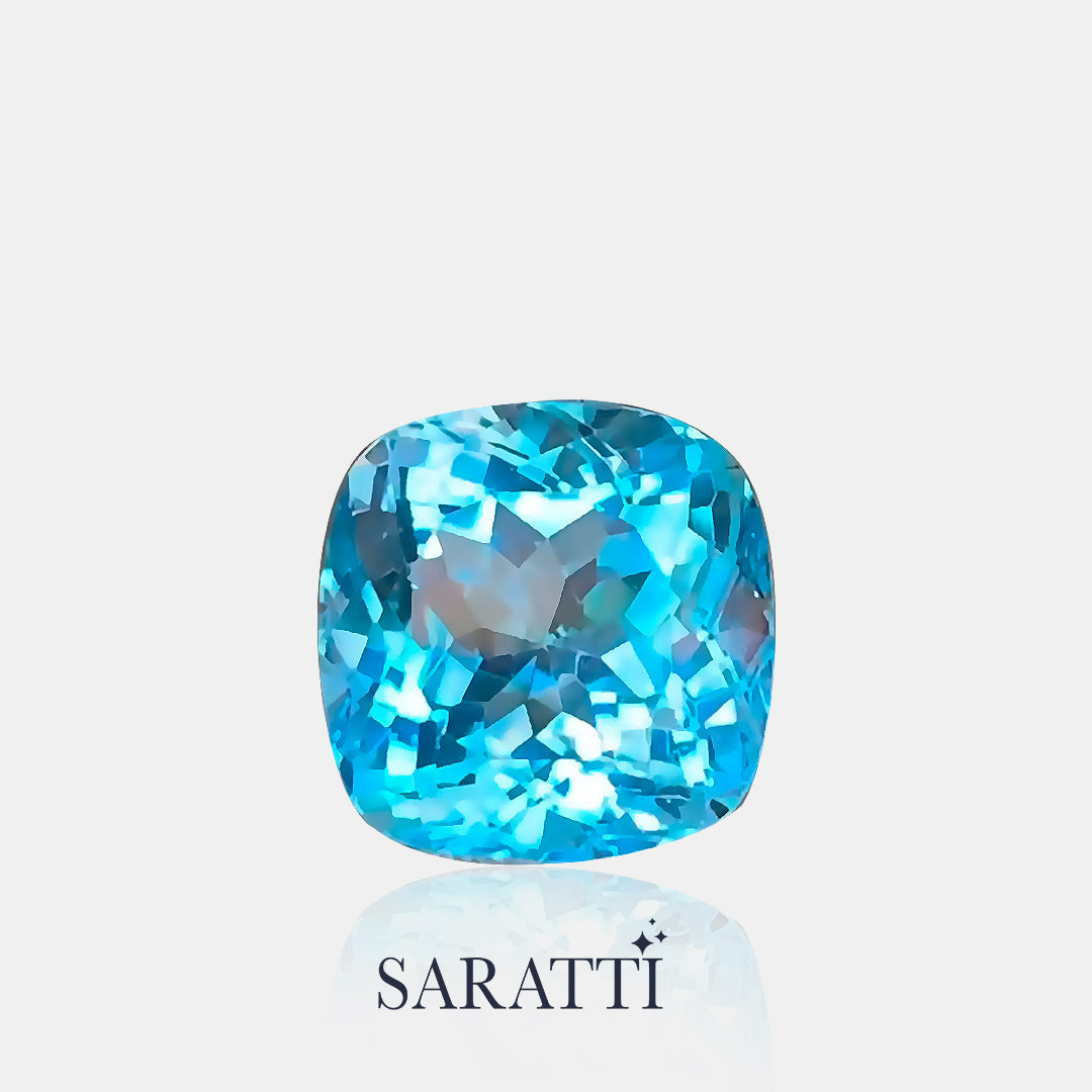 Close-up of Natural blue topaz cushion brilliant faceting | SARATTI