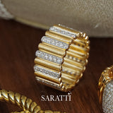 Close-up of gold ribbed band featuring diamond bar detailing, high jewelry craftsmanship | SARATTI