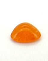Close-up of orange Garnet polished cabochon surface | SARATTI