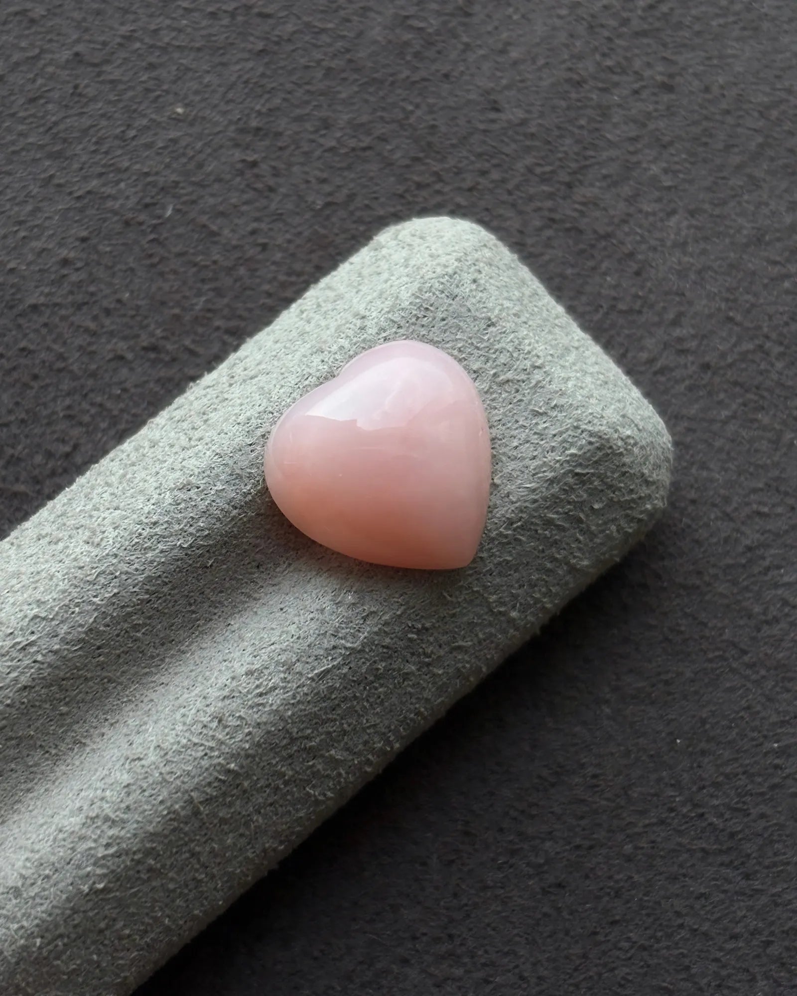 Close-up of polished Ethiopian Pink Opal heart gemstone | SARATTI