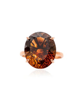 Cognac Imperial Topaz engagement ring featuring an oval center and six-petal 18K rose gold setting | SARATTI