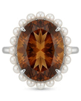 Collector-style statement ring featuring natural Imperial Topaz, pearl halo, and premium platinum | SARATTI