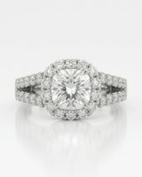 Colorless cushion moissanite framed by round stones with a coordinating white gold eternity band | SARATTI