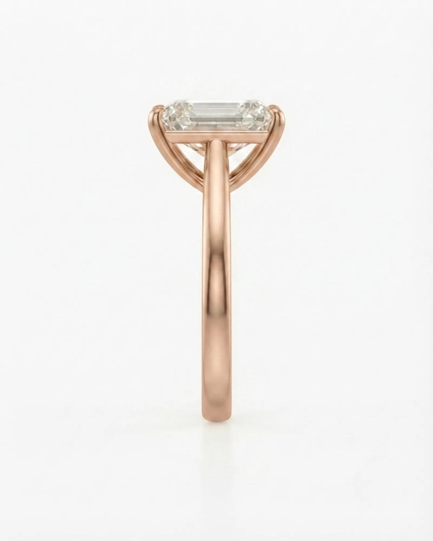 Colorless emerald-cut moissanite ring with step-cut facets and romantic rose gold setting | SARATTI