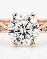 Colorless moissanite center with delicate pavé detailing in 18K rose gold | SARATTI
