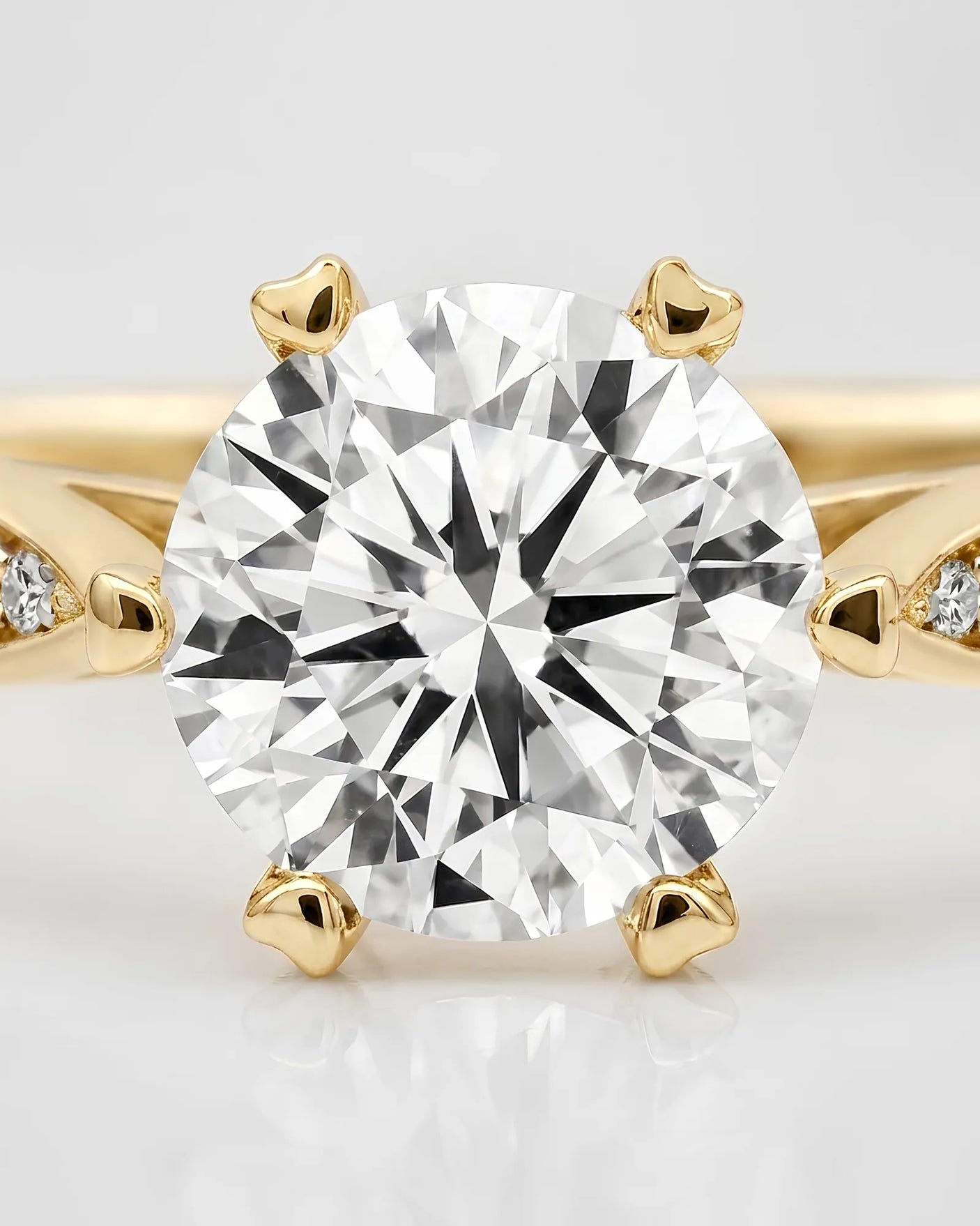 Colorless moissanite center with pavé accents in polished 18K yellow gold | SARATTI