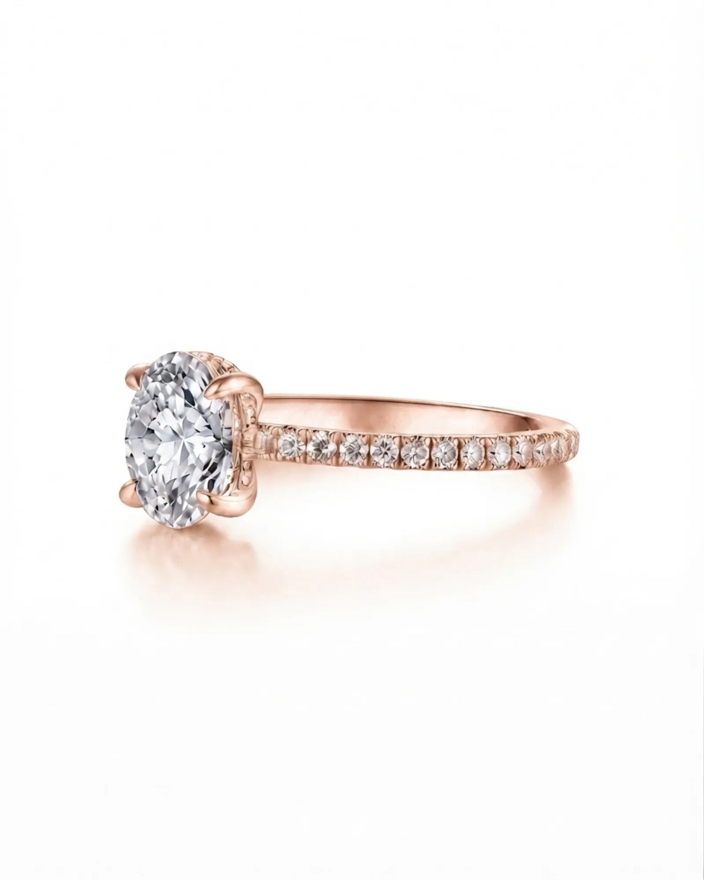 Colorless oval moissanite center with round pavé accents in romantic rose gold | SARATTI.