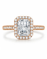 Colorless radiant-cut moissanite surrounded by round accents in romantic rose gold | SARATTI