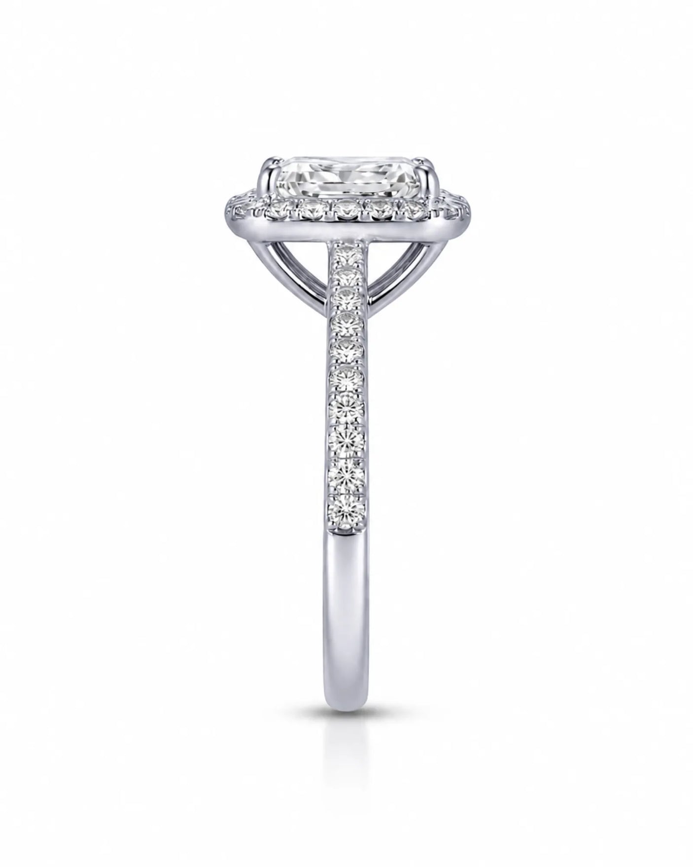 Colorless radiant-cut moissanite surrounded by round halo accents in polished platinum | SARATTI