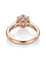 Colorless round moissanite framed by an eight-prong rose gold flower-inspired crown | SARATTI