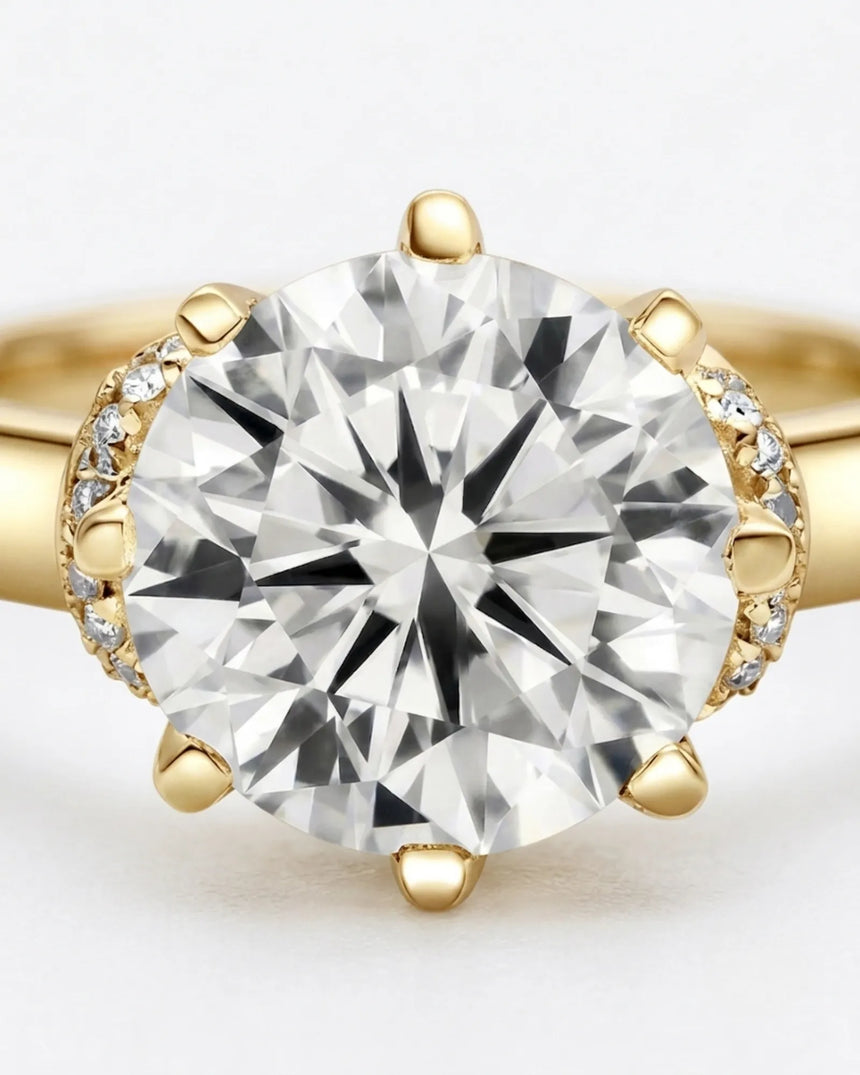Colorless round moissanite framed by an eight-prong yellow gold flower-inspired crown | SARATTI