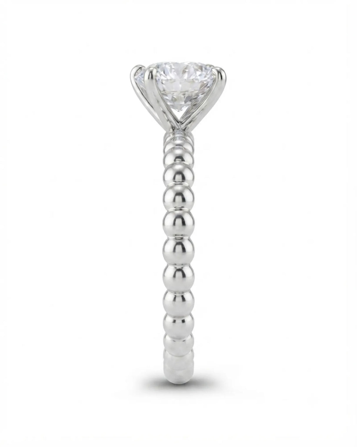 Colorless round moissanite ring framed by four platinum prongs and rhythmic spherical detailing | SARATTI