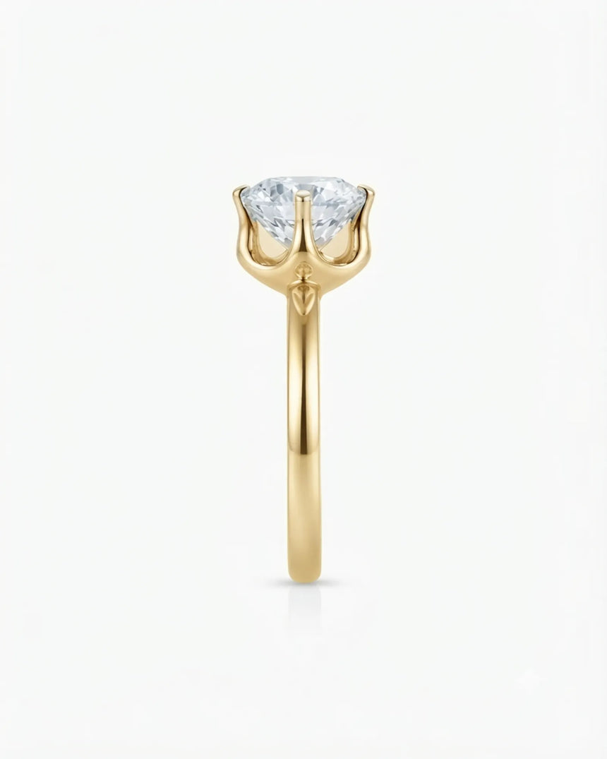 Colorless round moissanite ring with open gallery and warm yellow gold six-prong profile | SARATTI