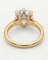 Colorless round moissanite solitaire ring with warm yellow gold six-prong crown | SARATTI