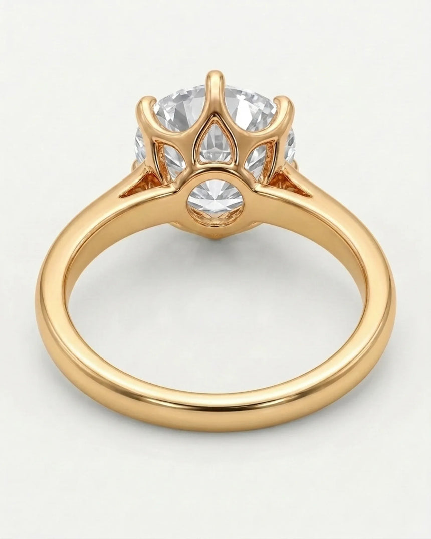Colorless round moissanite solitaire ring with warm yellow gold six-prong crown | SARATTI