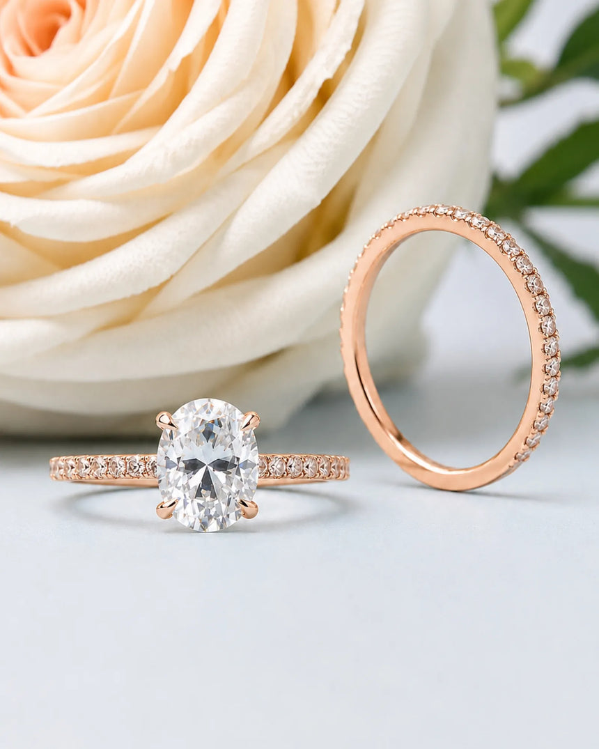 Coordinated oval moissanite ring set with parallel pavé bands and hidden halo in 18K rose gold | SARATTI