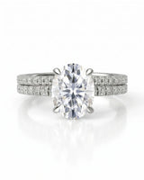 Coordinated oval moissanite ring set with parallel pavé bands and hidden halo in 18K white gold | SARATTI