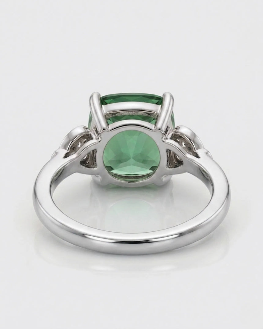 Cushion-cut green tourmaline ring with round diamond accents in a timeless platinum design | SARATTI