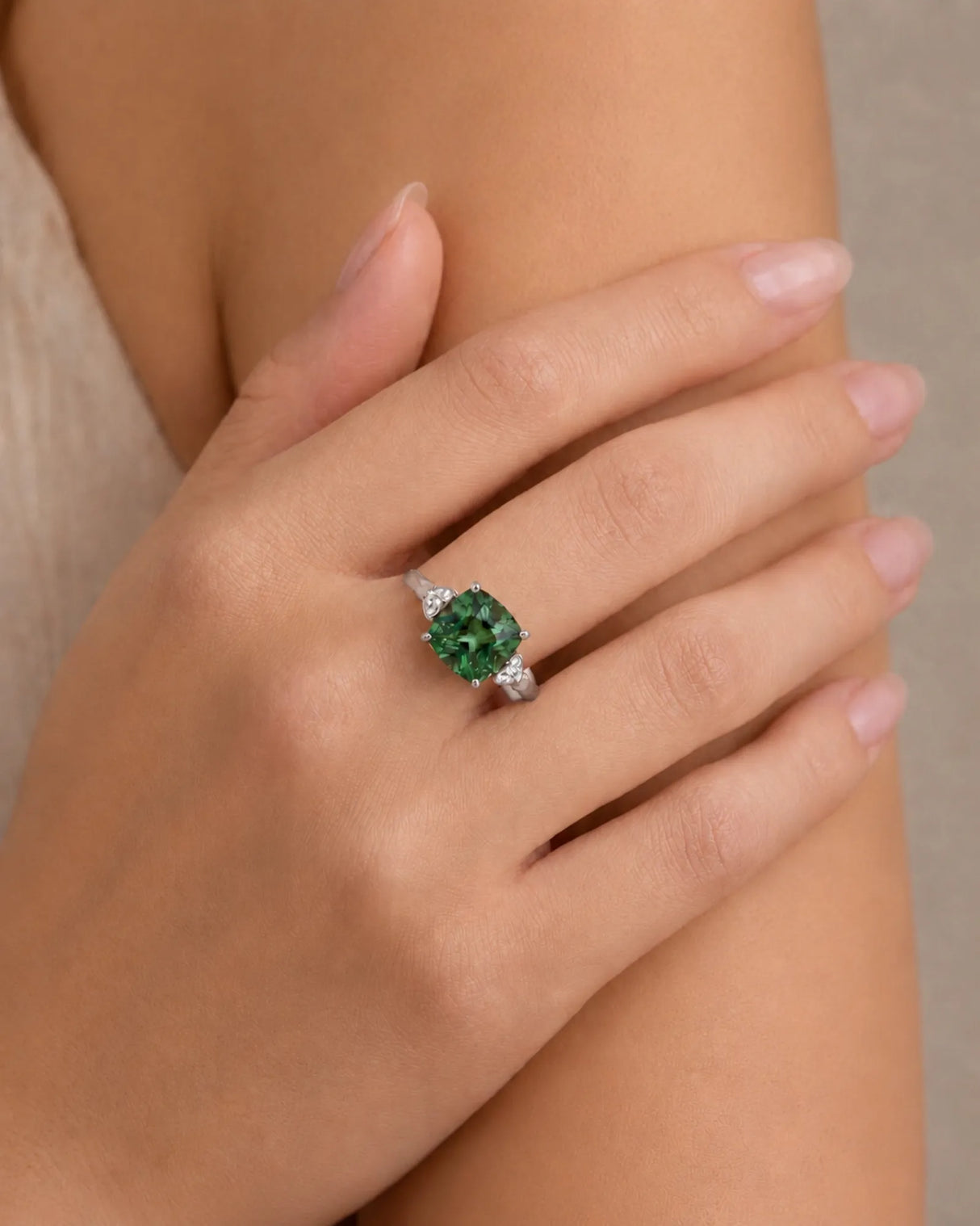 Cushion-cut green tourmaline ring with round diamond accents in elegant 18K white gold | SARATTI