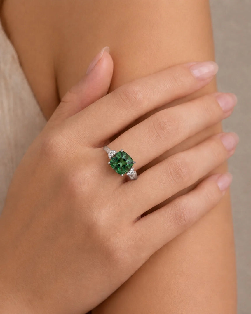 Cushion-cut green tourmaline ring with round diamond accents in elegant 18K white gold | SARATTI
