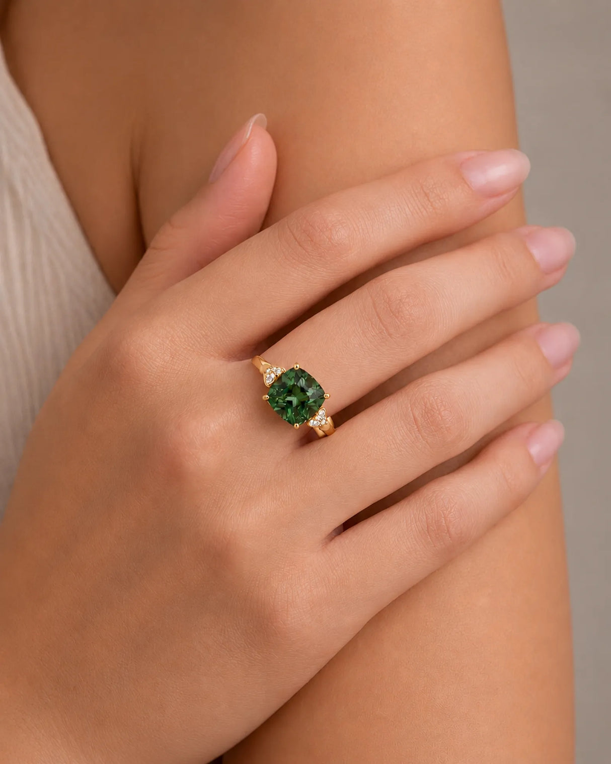 Cushion-cut green tourmaline ring with round diamond accents in polished 18K yellow gold | SARATTI