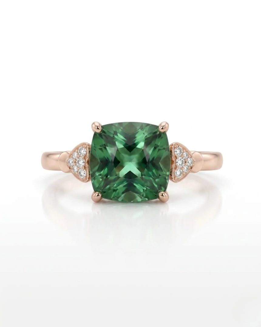 Cushion-cut green tourmaline ring with round diamond accents in warm 18K rose gold | SARATTI