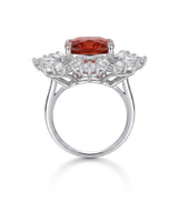 Cushion-cut red tourmaline ring with sculptural diamond accents in a platinum design | SARATTI