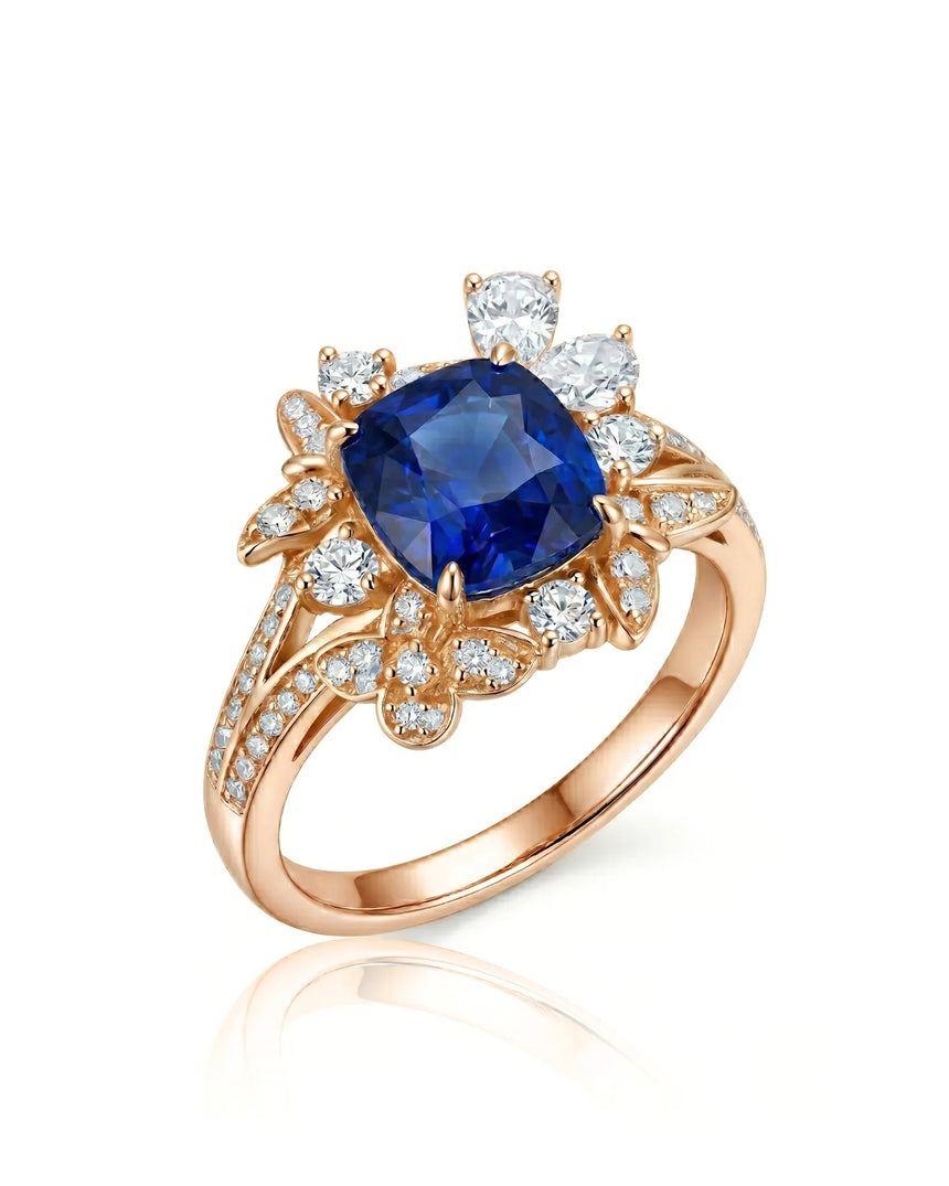 Cushion-cut royal blue sapphire ring with floral diamond halo in 18K rose gold | SARATTI