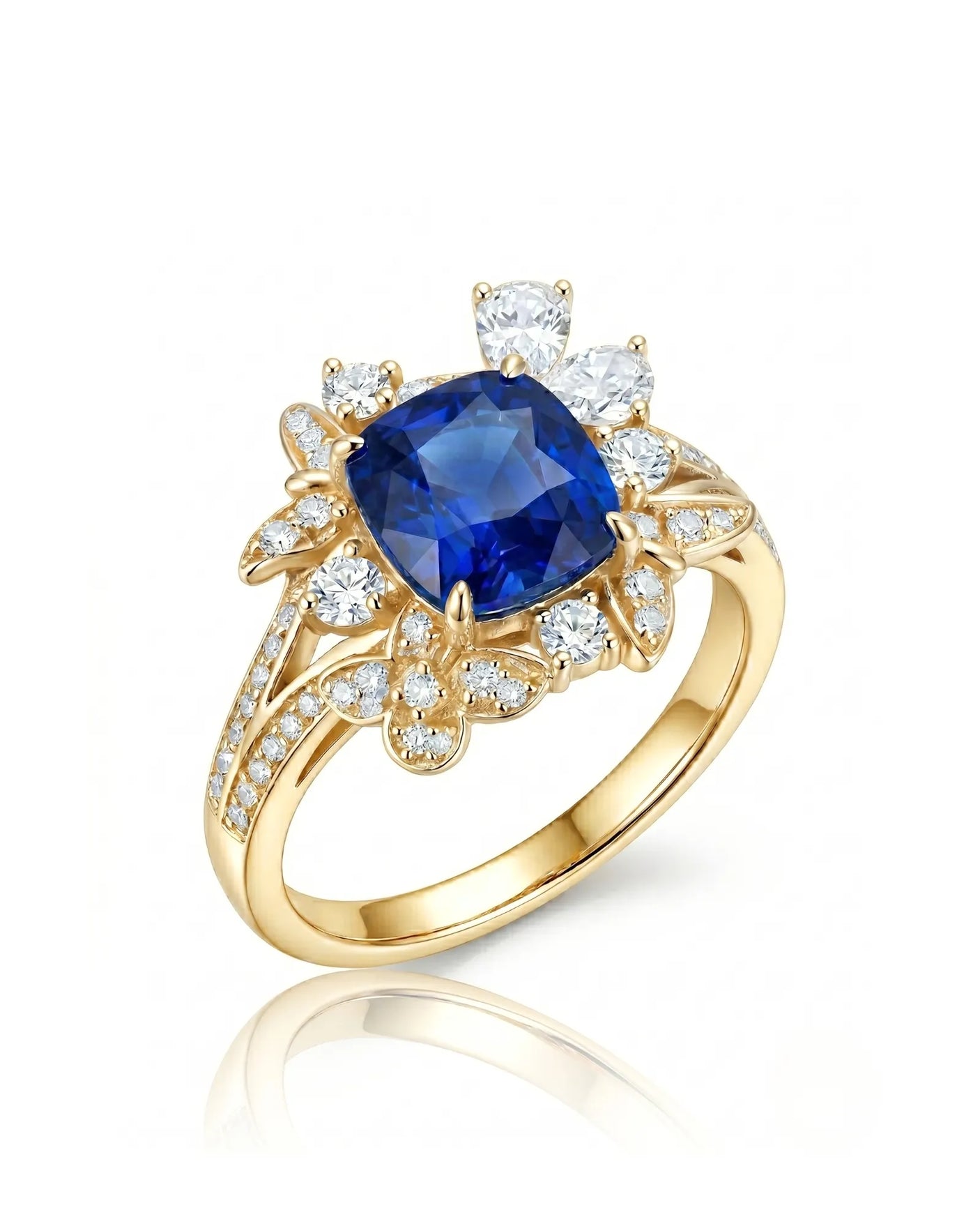 Cushion-cut royal blue sapphire ring with floral diamond halo in 18K yellow gold | SARATTI