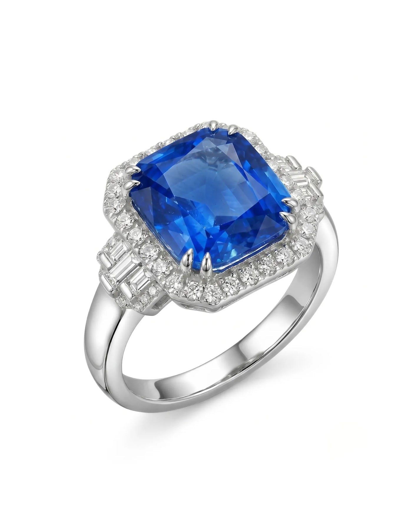 Cushion cut blue sapphire ring with diamond halo and baguette shoulders in 18K white gold | SARATTI