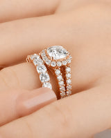 Cushion moissanite bridal set in rose gold with round halo accents and divided shoulders | SARATTI