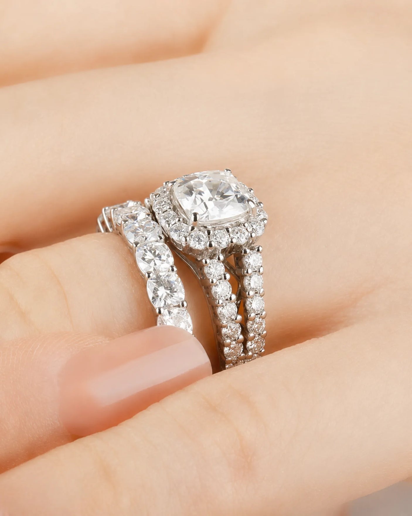 Cushion moissanite bridal set in white gold with round halo accents and divided shoulders | SARATTI
