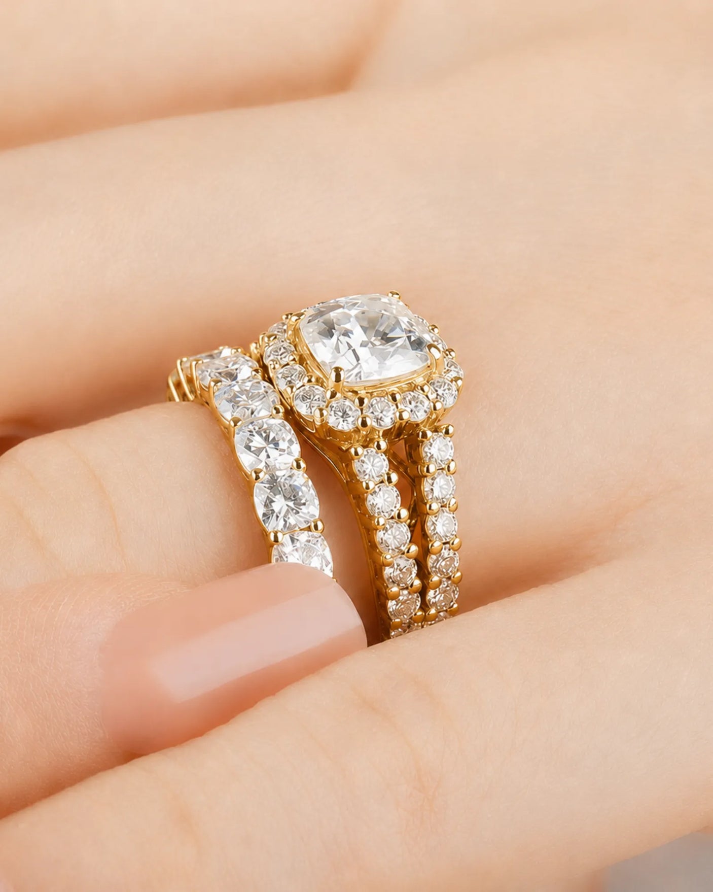 Cushion moissanite bridal set in yellow gold with round halo accents and divided shoulders | SARATTI