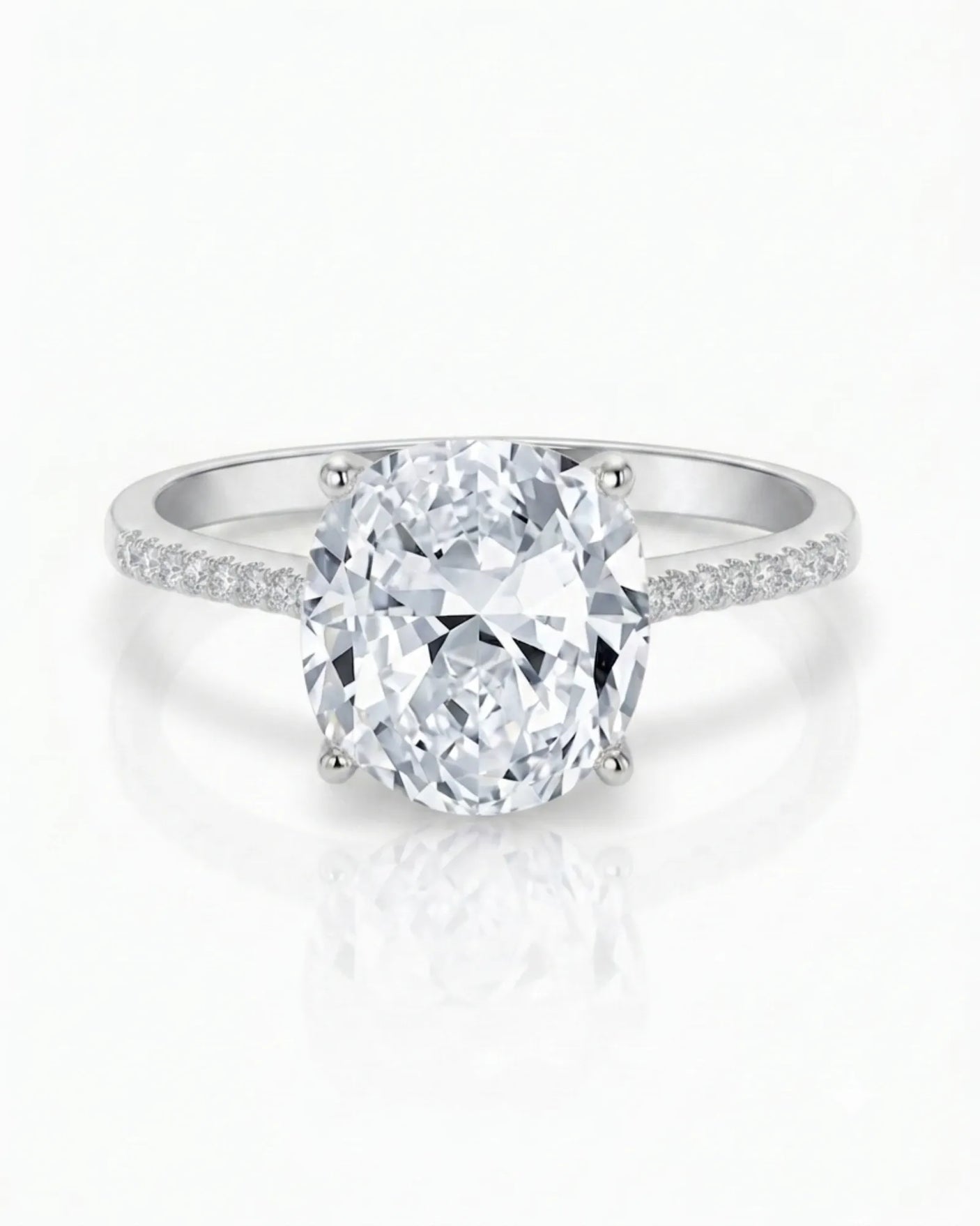 Cushion moissanite center stone ring with round side stones in platinum | SARATTI