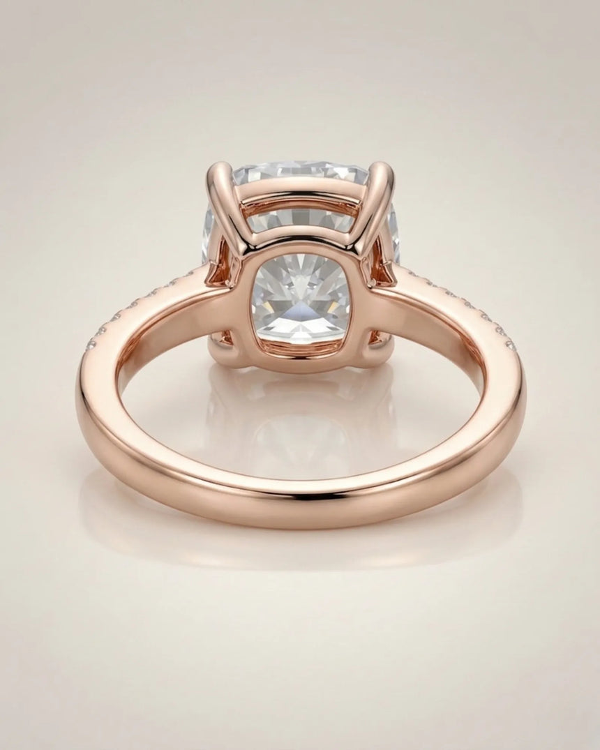 Cushion moissanite center stone ring with round side stones in rose gold | SARATTI